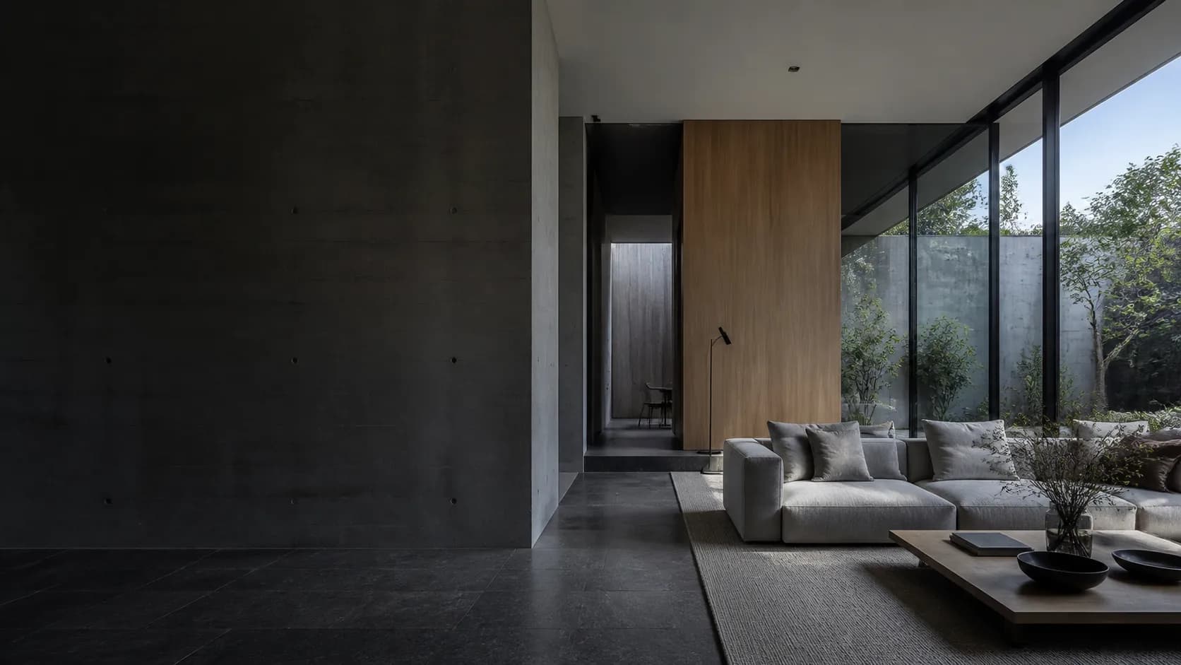 Contemporary residence with concrete, dark timber and soft daylight